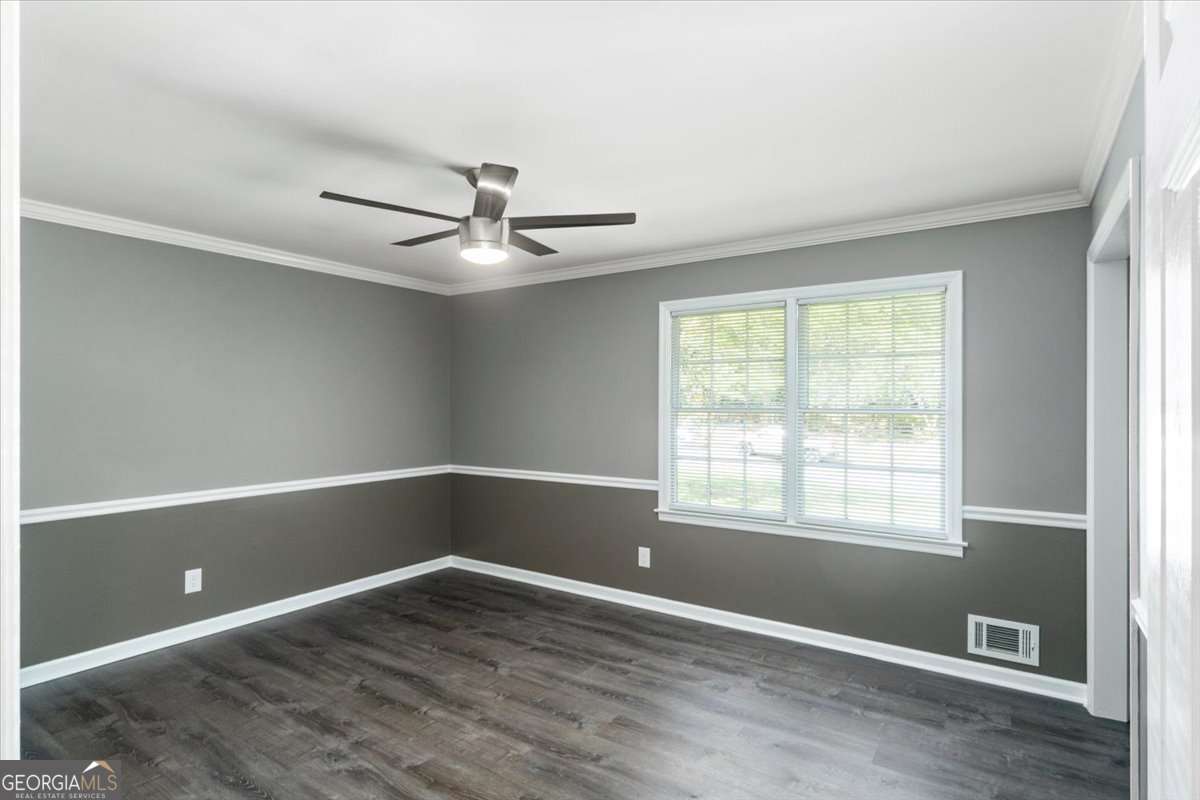 148 Bunker Drive Athens, GA 30607 - Photo 22 of 38 a view of an empty room with window and wooden floor