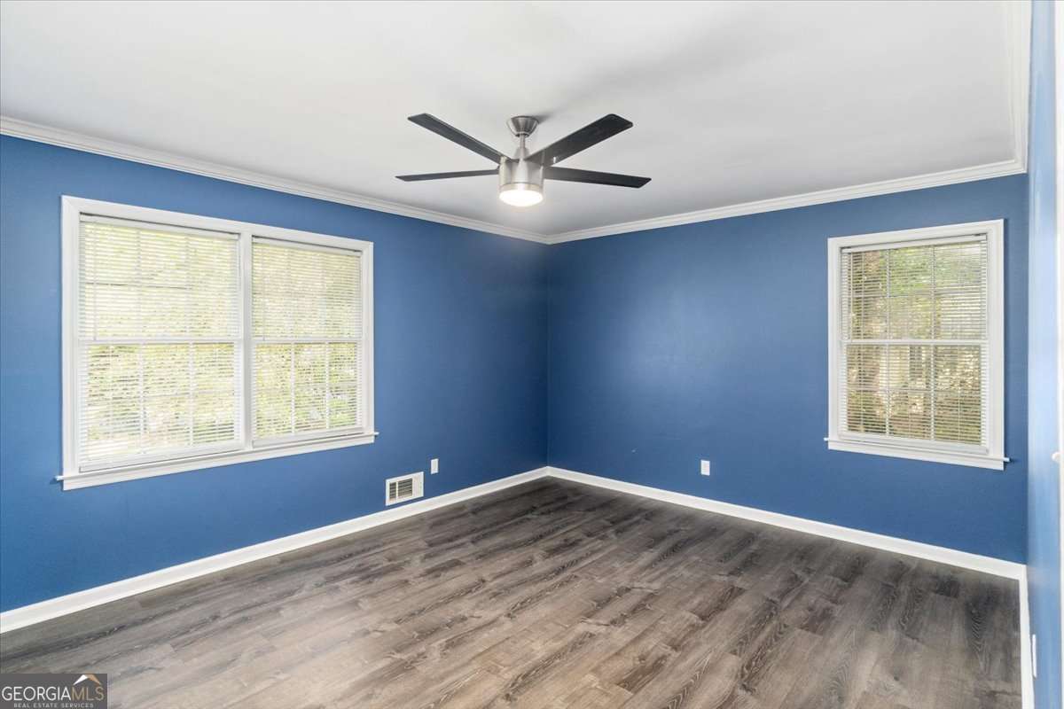 148 Bunker Drive Athens, GA 30607 - Photo 23 of 38 a view of an empty room with wooden floor and a window