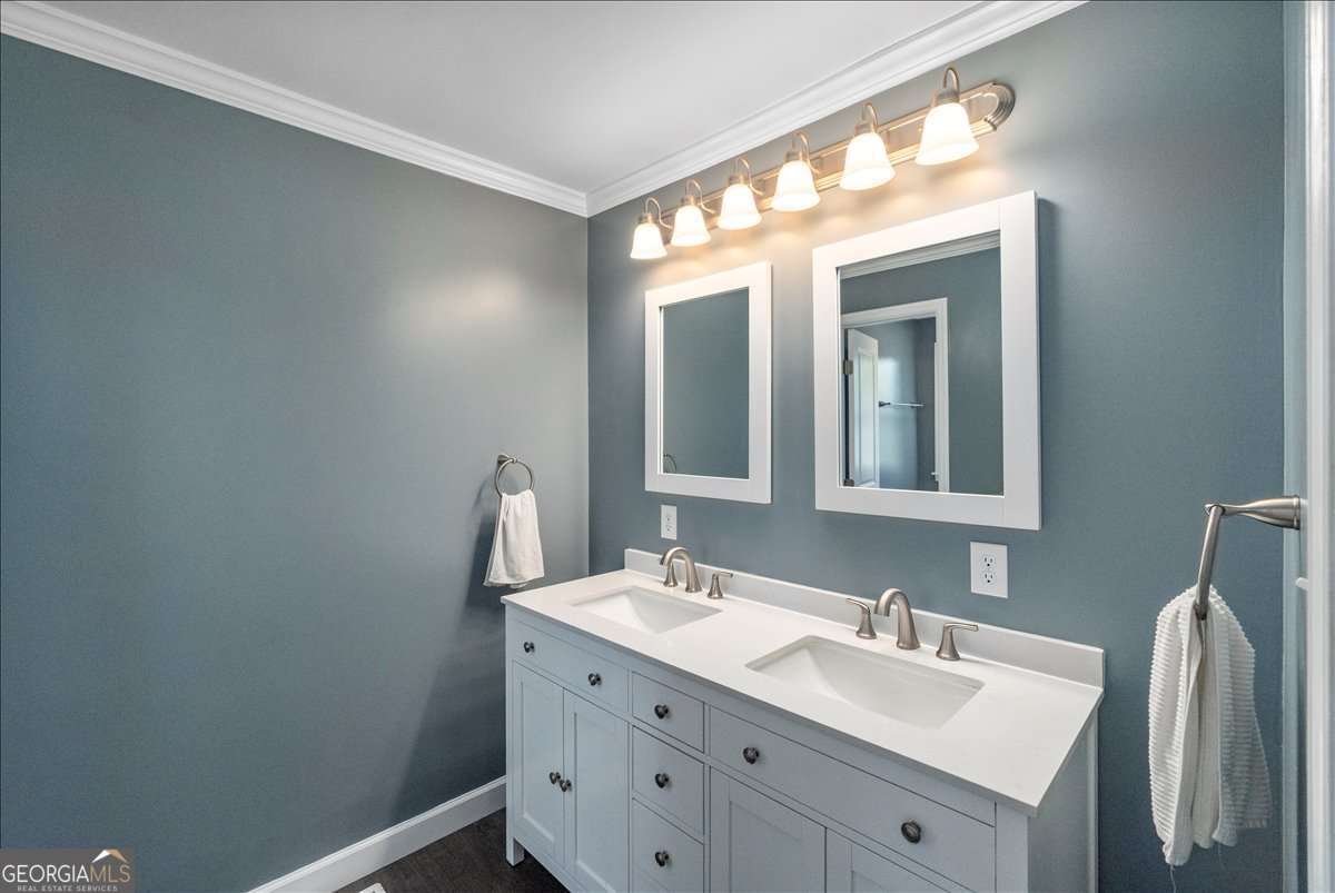 148 Bunker Drive Athens, GA 30607 - Photo 27 of 38 a bathroom with a double vanity sink and a mirror