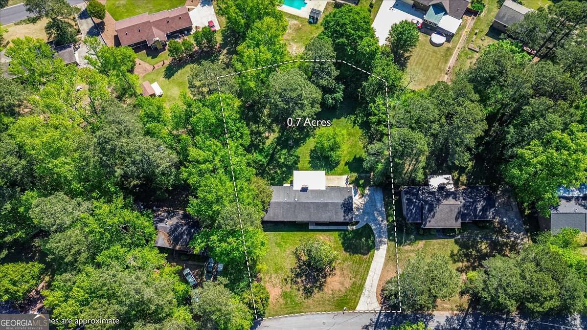 148 Bunker Drive Athens, GA 30607 - Photo 30 of 38 an aerial view of a house with a garden and trees
