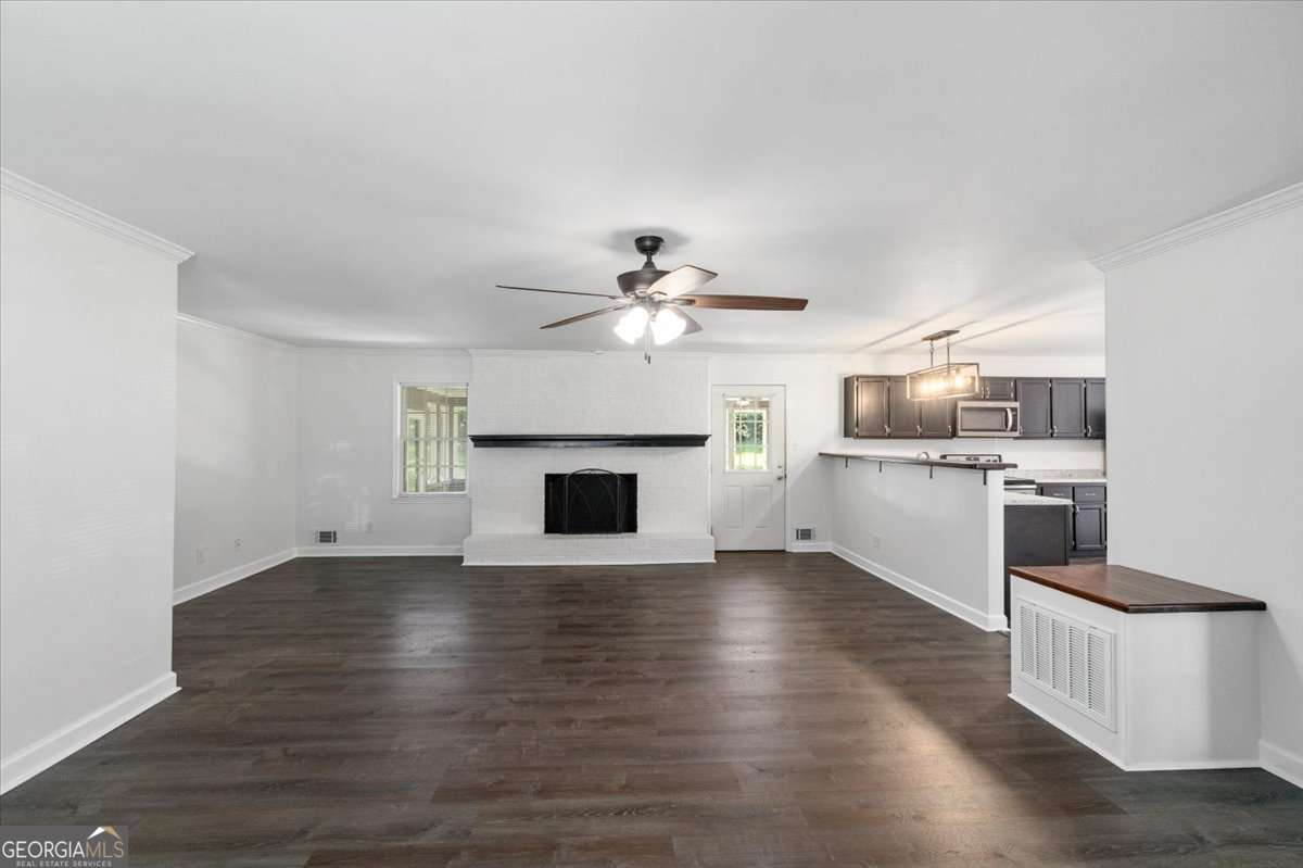 148 Bunker Drive Athens, GA 30607 - Photo 5 of 38 a view of a kitchen with a sink and a fireplace
