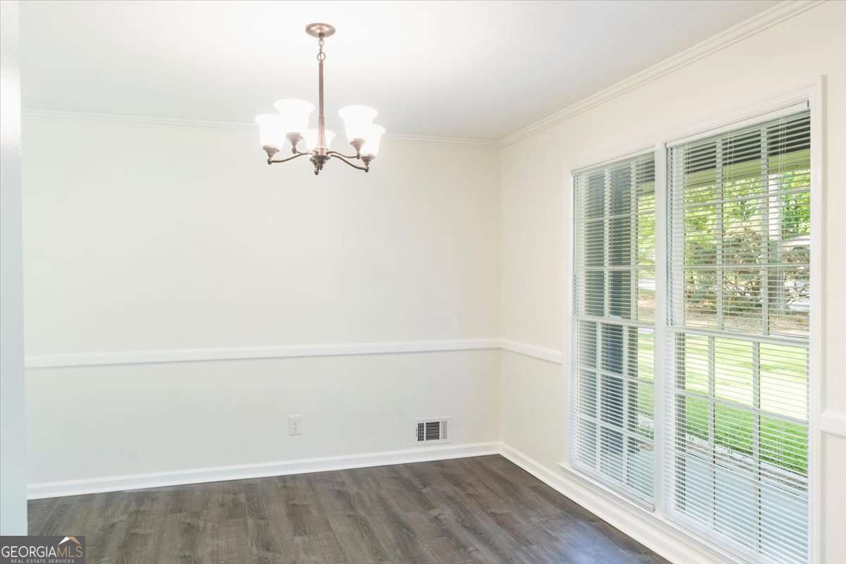 148 Bunker Drive Athens, GA 30607 - Photo 7 of 38 an empty room with wooden floor and windows