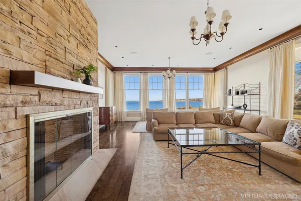a living room with furniture fireplace and a flat screen tv