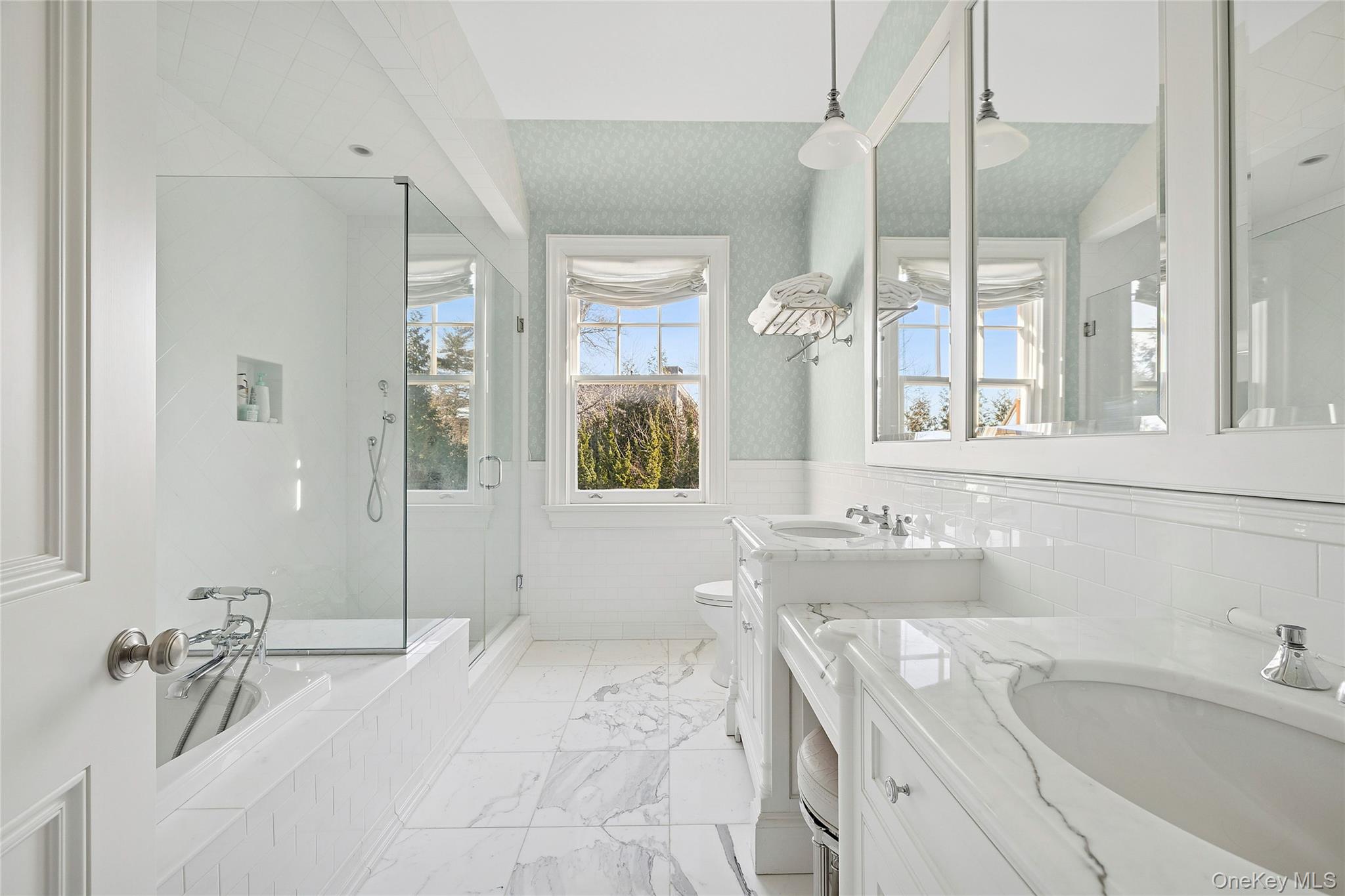 30 Forest Drive Sands Point, NY 11050 - Photo 19 of 27 a bathroom with a tub sink and mirror