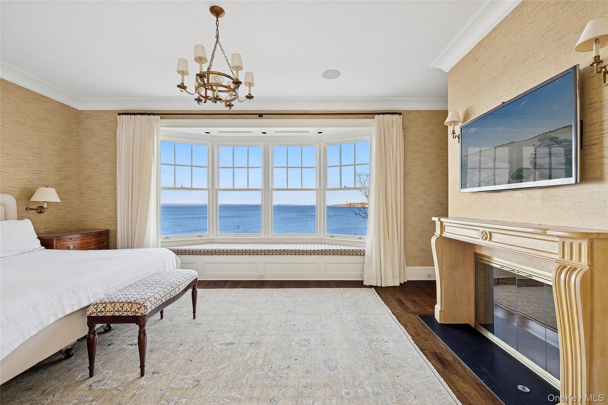 30 Forest Drive Sands Point, NY 11050 - Photo 21 of 27 a view of a livingroom with furniture a fireplace and chandelier