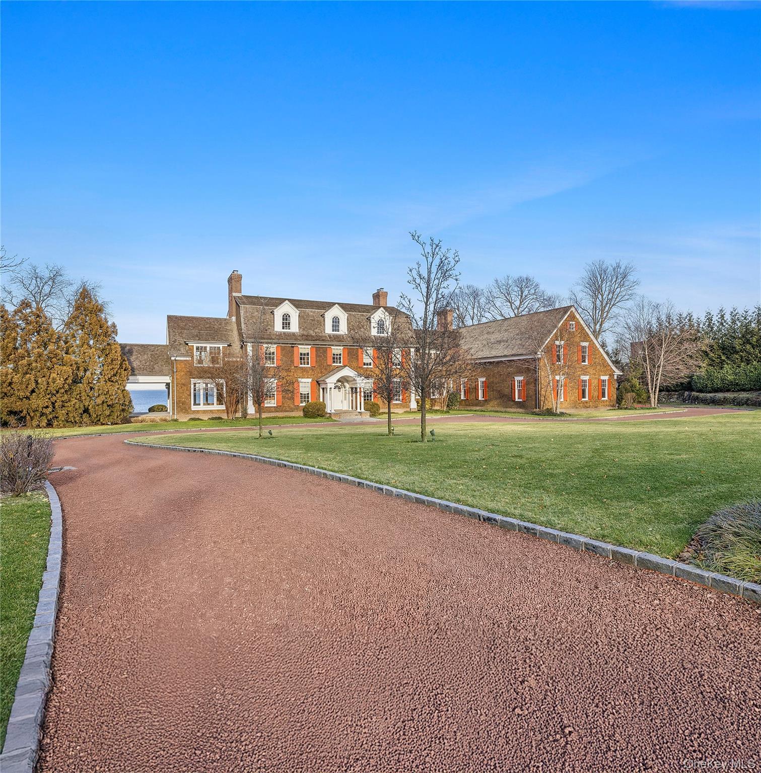 30 Forest Drive Sands Point, NY 11050 - Photo 24 of 27 a view of a house with a big yard and large trees