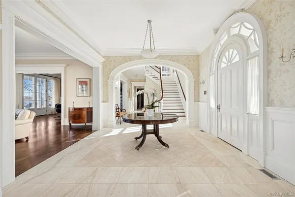 a view of hall way with furniture