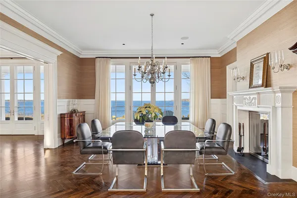 a view of a dining room with furniture wooden floor and chandelier