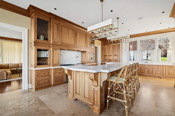 a kitchen with stainless steel appliances granite countertop a stove and cabinets