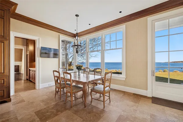 a view of a dining room with furniture and window