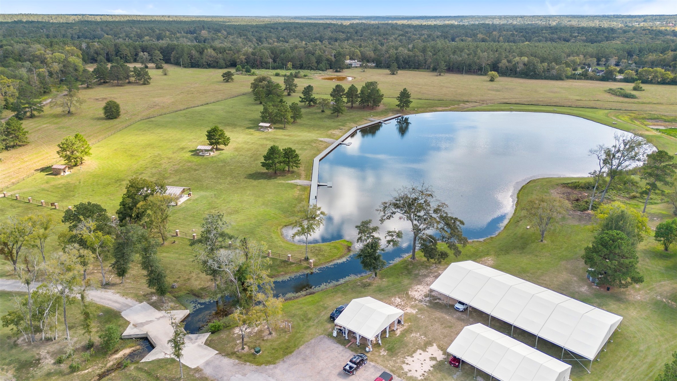 an aerial view of a house with a lake view