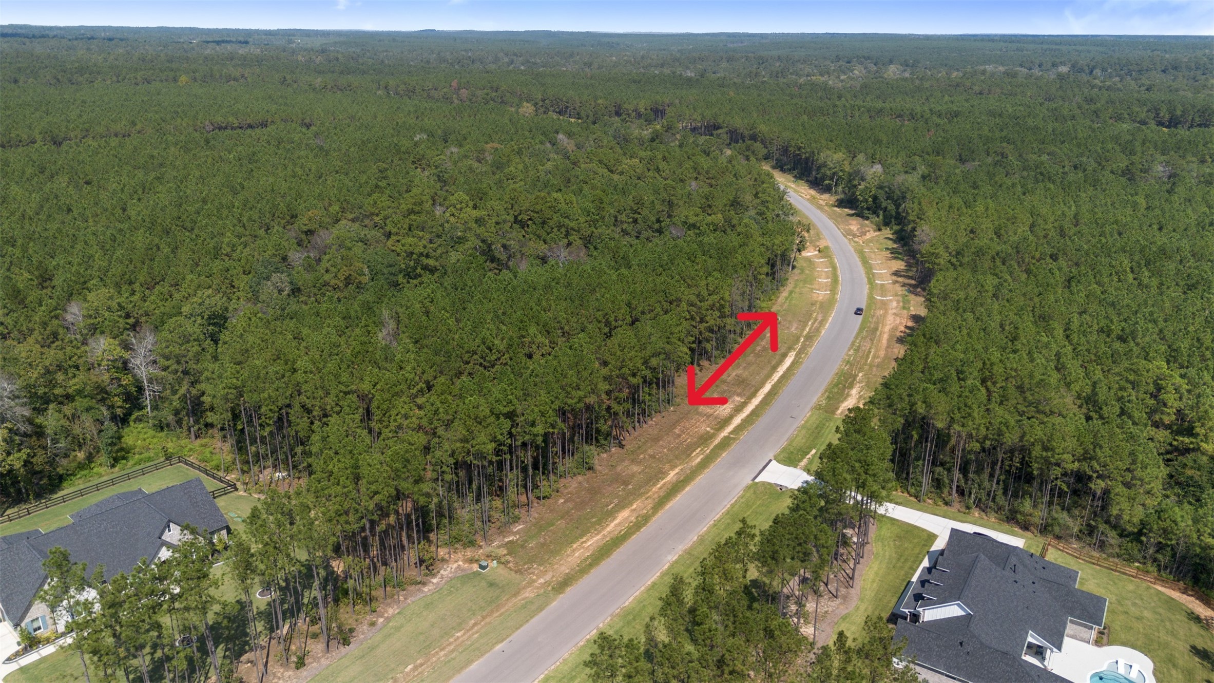 15896 Ridge Oak Road Willis, TX 77378 - Photo 11 of 23 a view of a lake with a yard