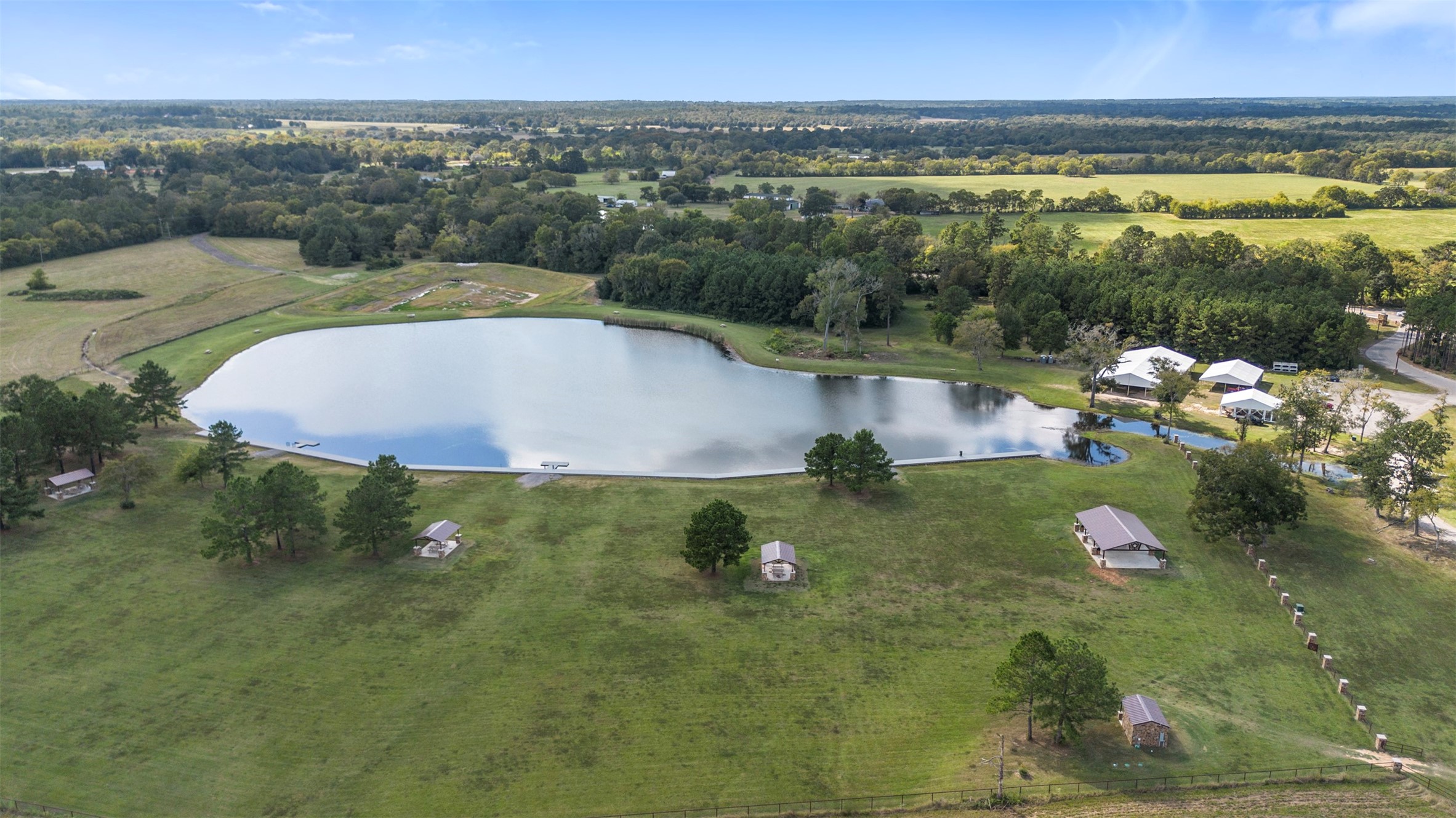 15896 Ridge Oak Road Willis, TX 77378 - Photo 2 of 23 a view of a lake with a yard