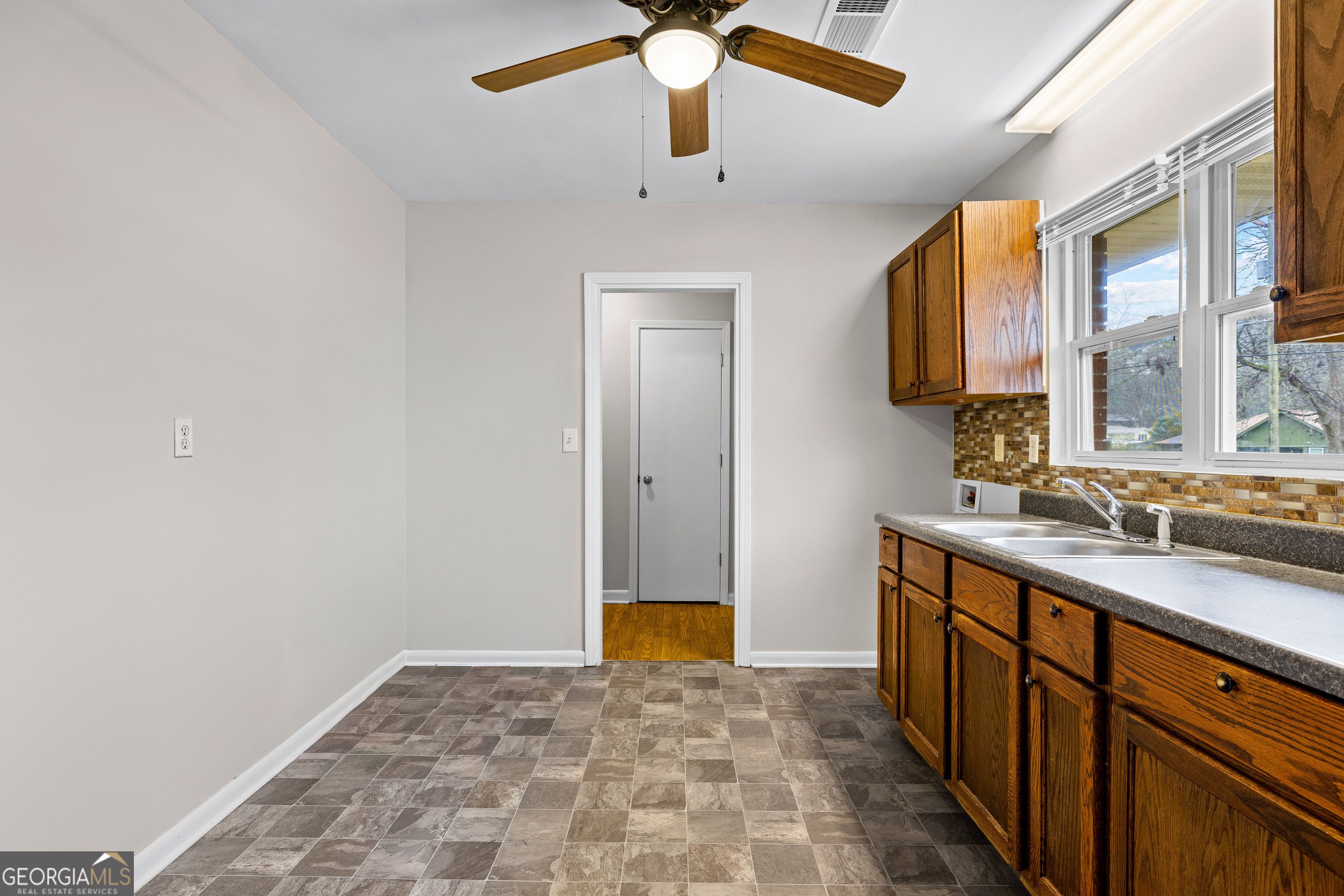 257 Fayetteville Road Fairburn, GA 30213 - Photo 11 of 31 a bathroom with a sink and a mirror