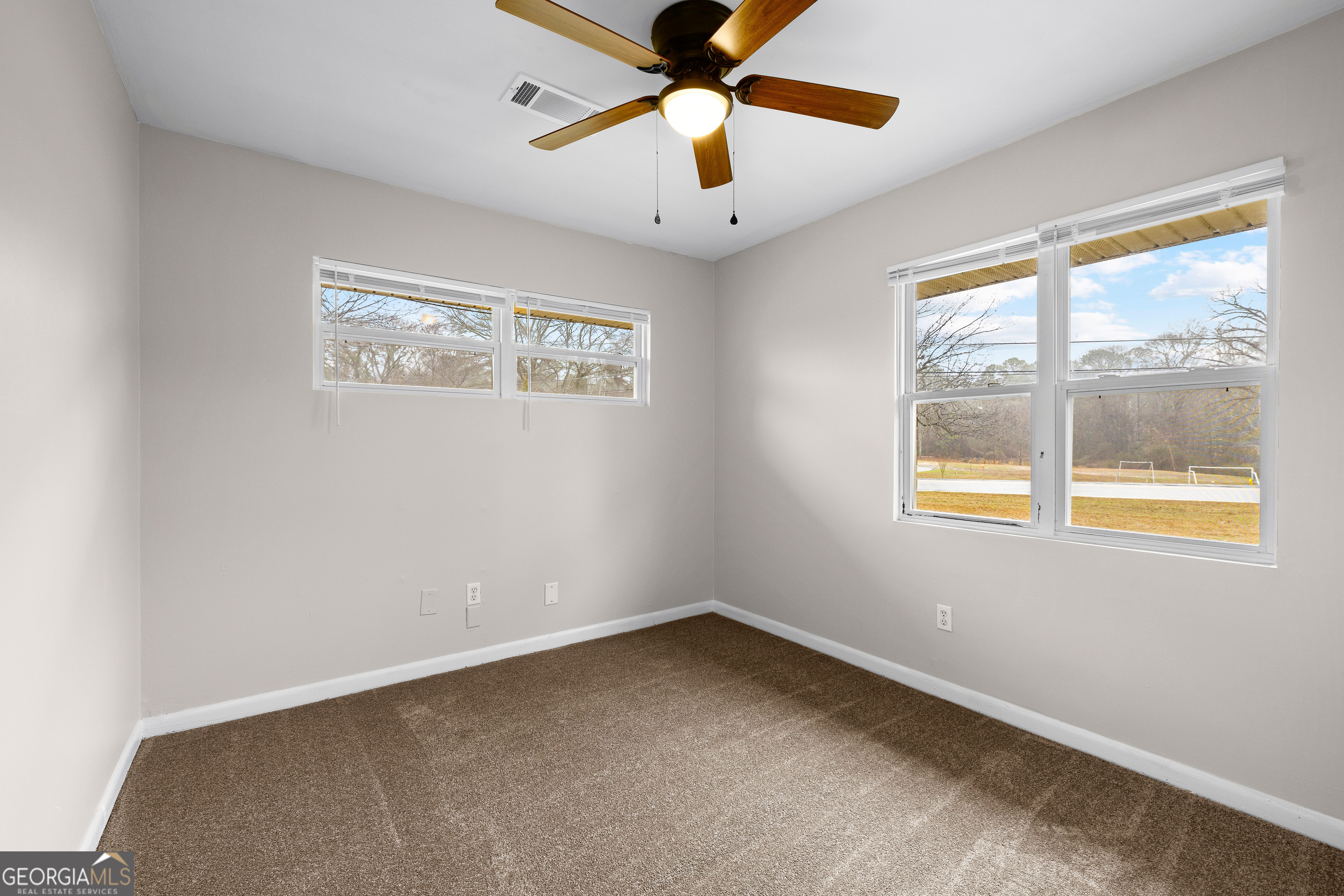 257 Fayetteville Road Fairburn, GA 30213 - Photo 14 of 31 a view of an empty room with a window
