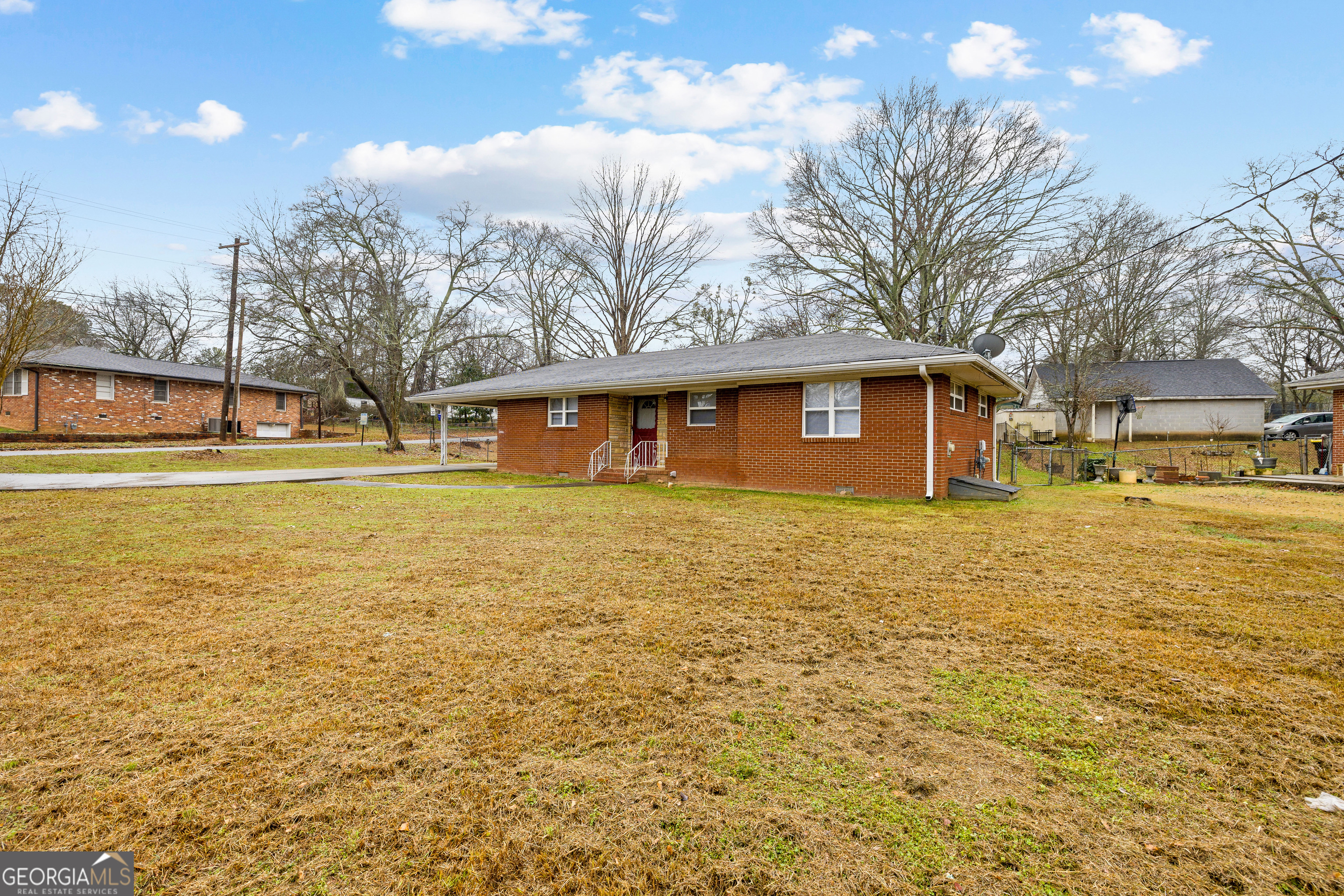 257 Fayetteville Road Fairburn, GA 30213 - Photo 2 of 31 a front view of a house with an ocean view