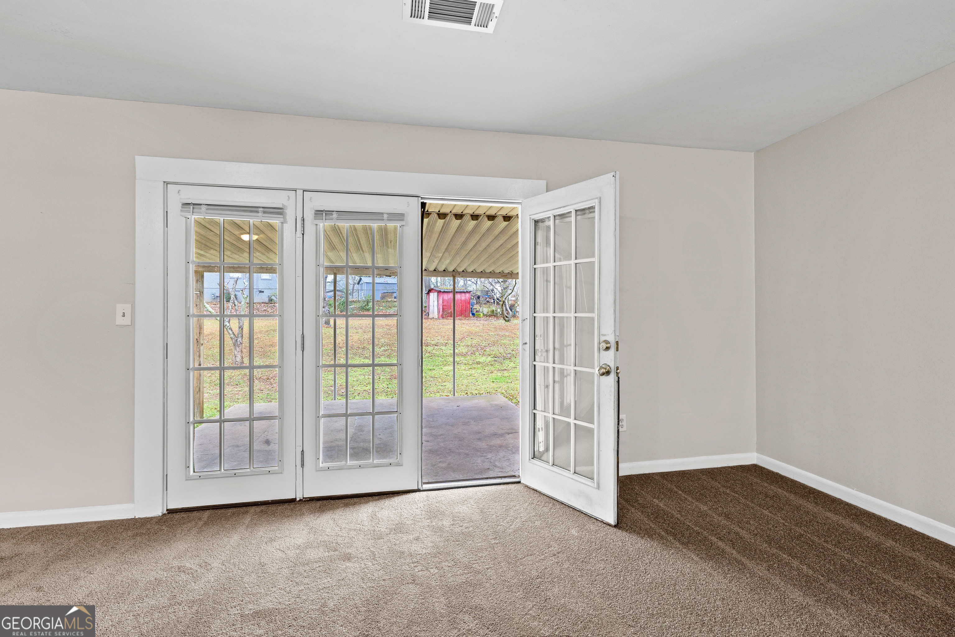 257 Fayetteville Road Fairburn, GA 30213 - Photo 24 of 31 a view of an empty room with glass door