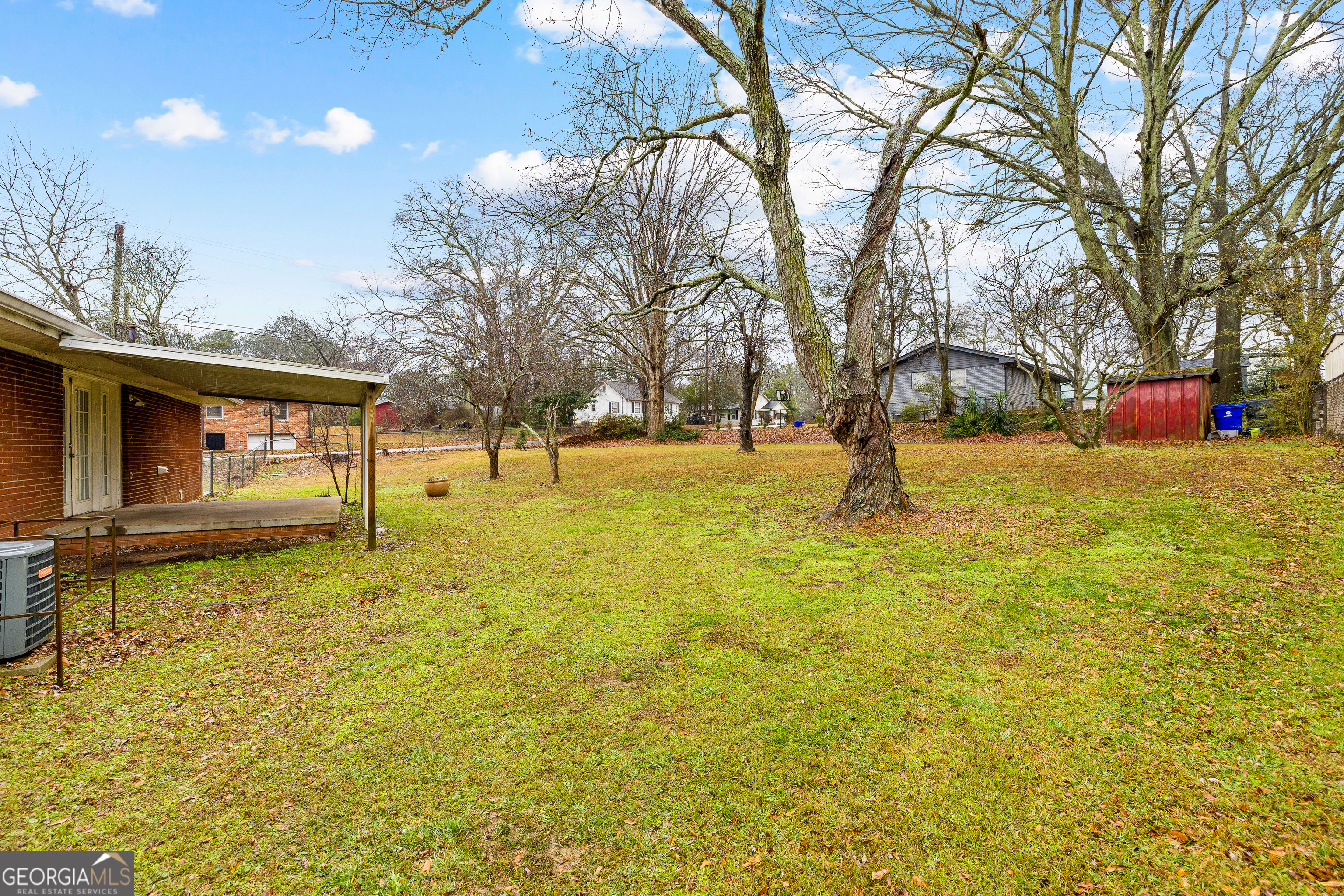 257 Fayetteville Road Fairburn, GA 30213 - Photo 27 of 31 a backyard of apartments with large trees