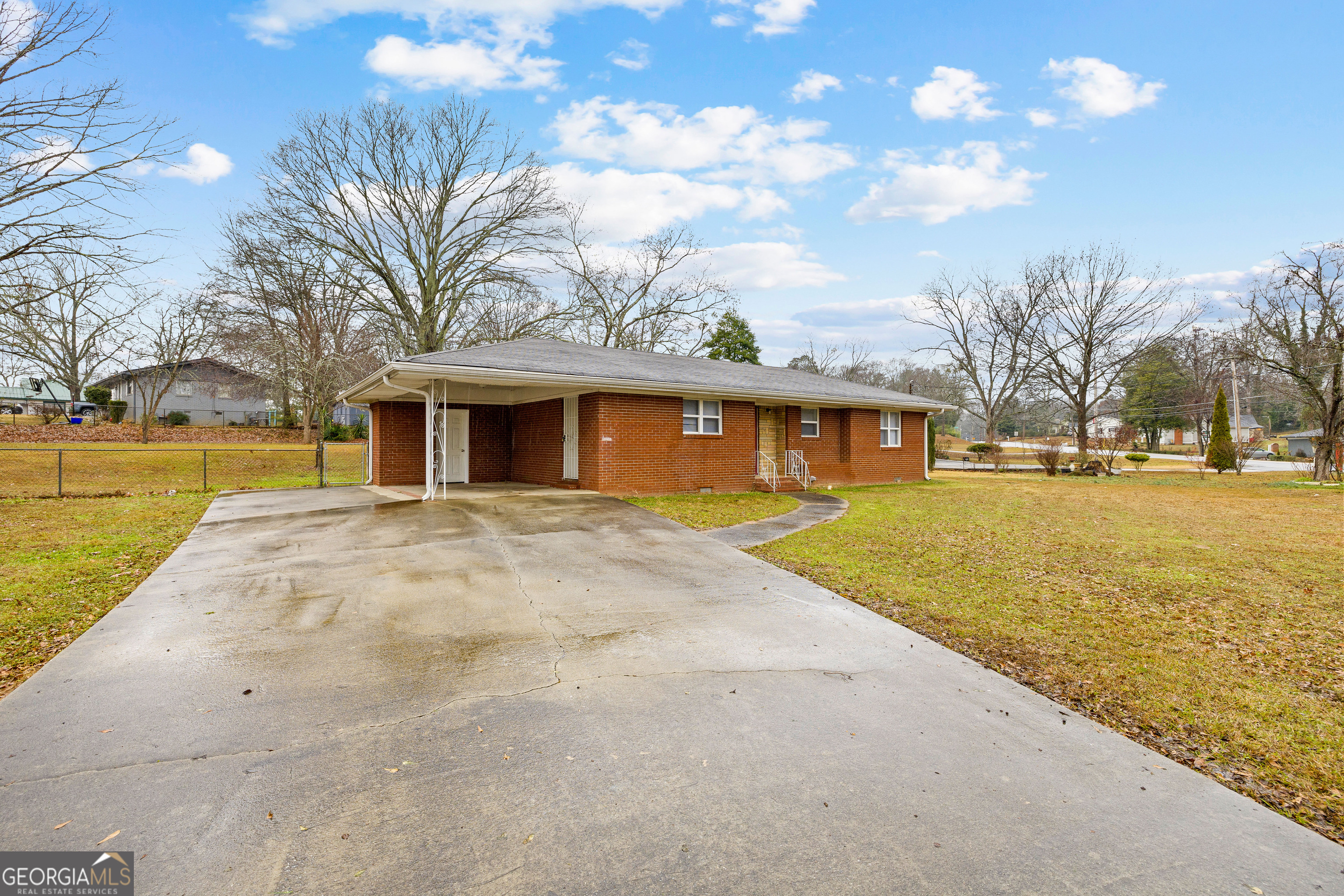 257 Fayetteville Road Fairburn, GA 30213 - Photo 3 of 31 a front view of a house with a yard