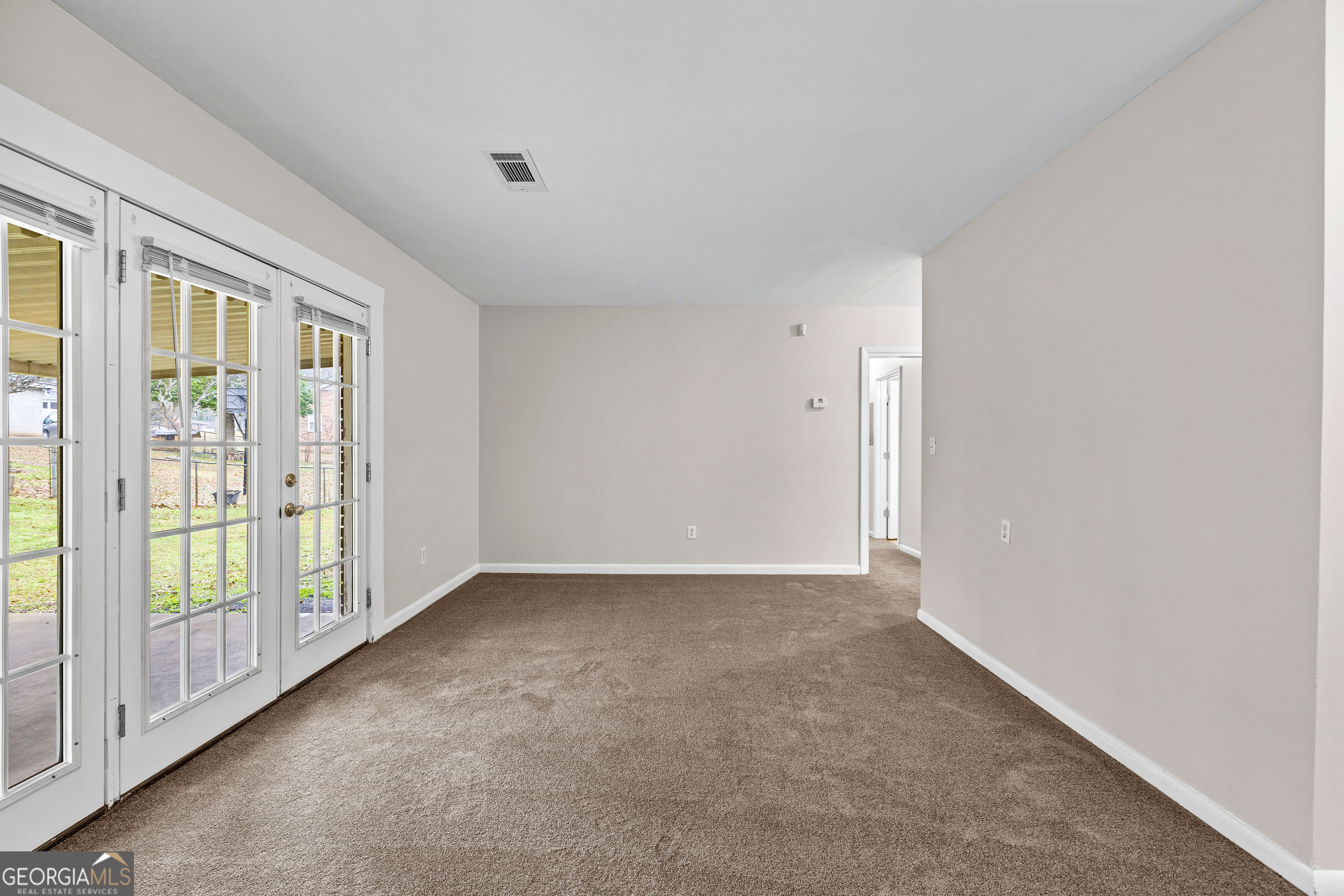 257 Fayetteville Road Fairburn, GA 30213 - Photo 5 of 31 a view of an empty room with glass door