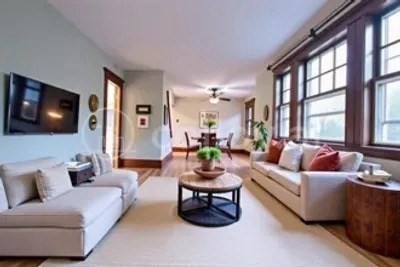 29 Oval Road Quincy, MA 02170 - Photo 2 of 11 a living room with furniture and a flat screen tv