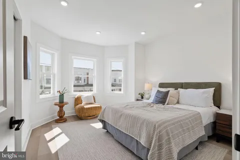 a bedroom with furniture and a window