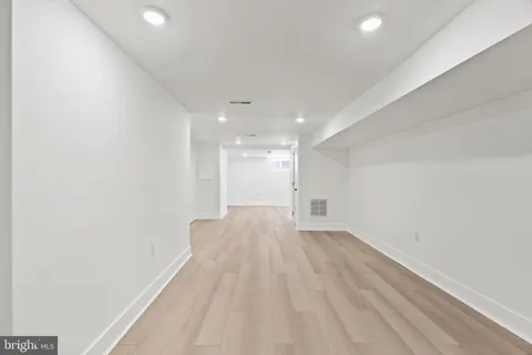 a view of a balcony with wooden floor