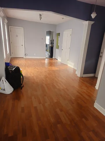 a room with a bed and cabinets