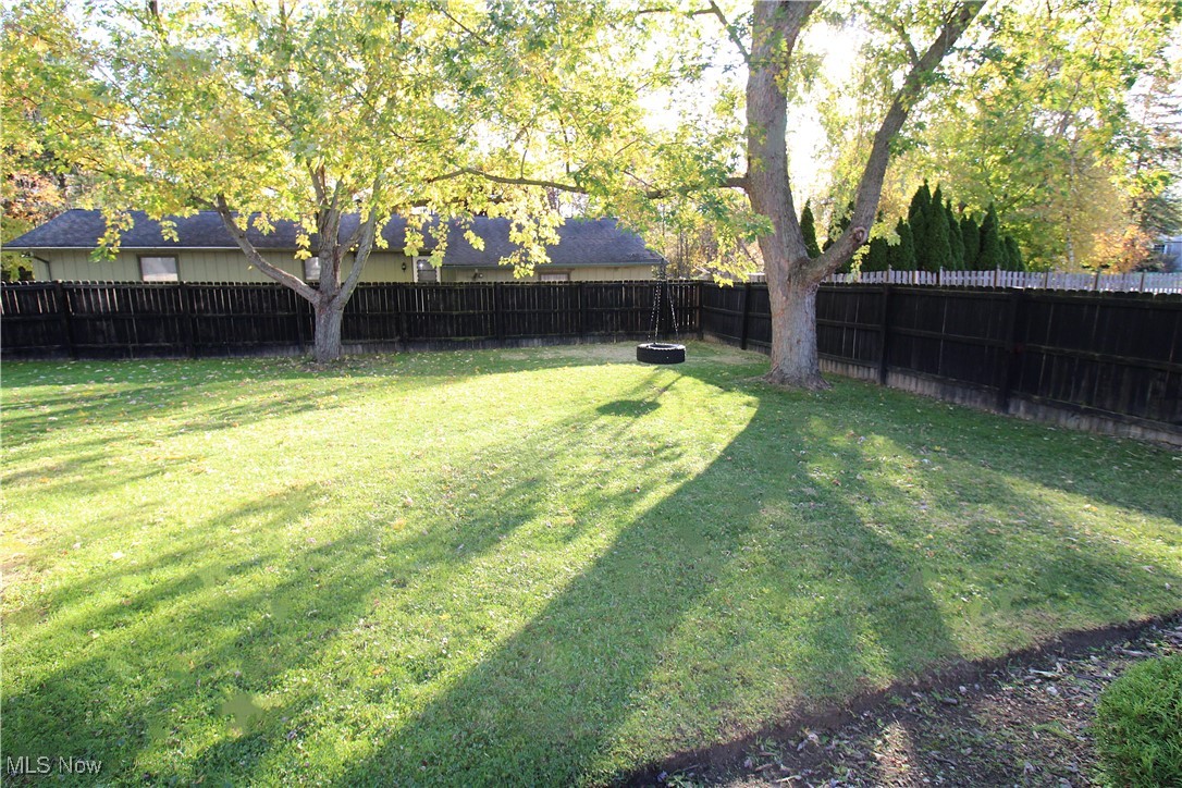 17567 Howe Road Strongsville, OH 44136 - Photo 9 of 30 View of Spacious Fully Fenced Yard and Tire Swing