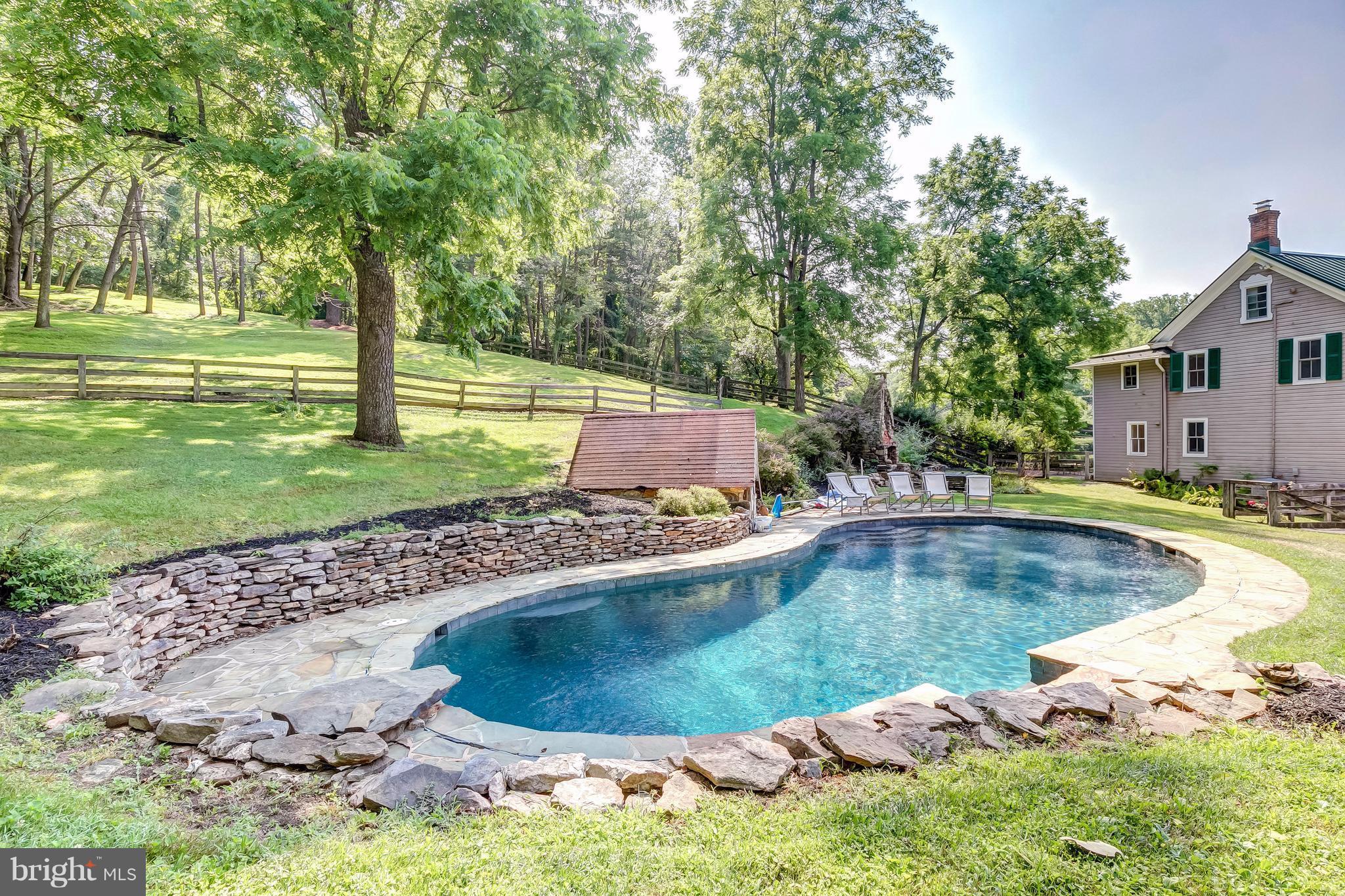 2148 Shepperd Road Monkton, MD 21111 - Photo 16 of 26 a view of a swimming pool with a yard