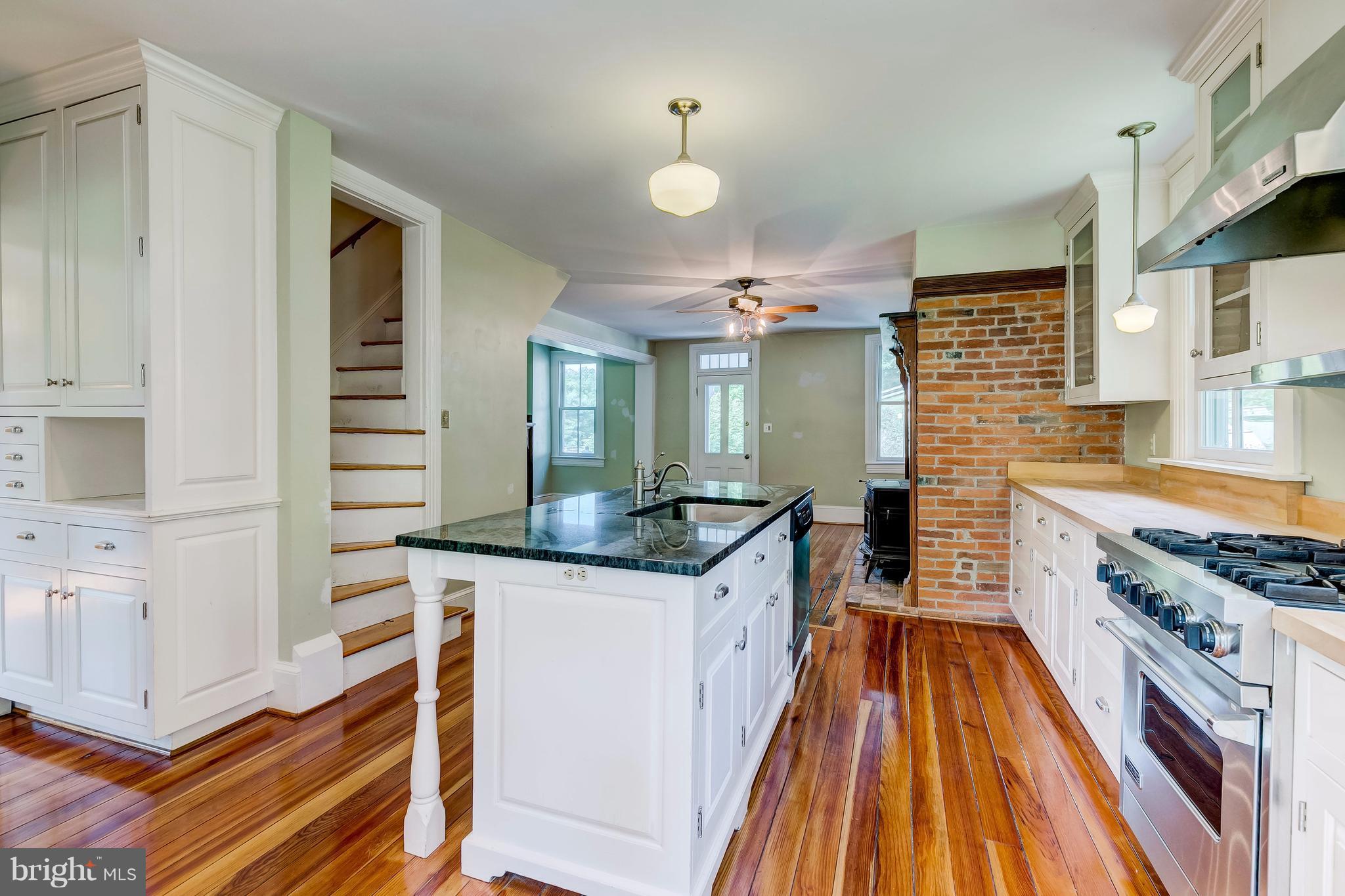 2148 Shepperd Road Monkton, MD 21111 - Photo 9 of 26 a kitchen with stainless steel appliances granite countertop a stove and a sink