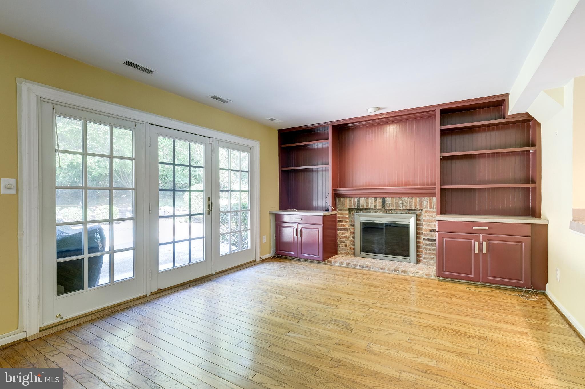 20513 Beaver Ridge Road Montgomery Village, MD 20886 - Photo 7 of 18 Family room with built-in bookcases