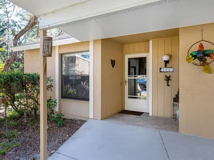 a view of a front door of the house and front door
