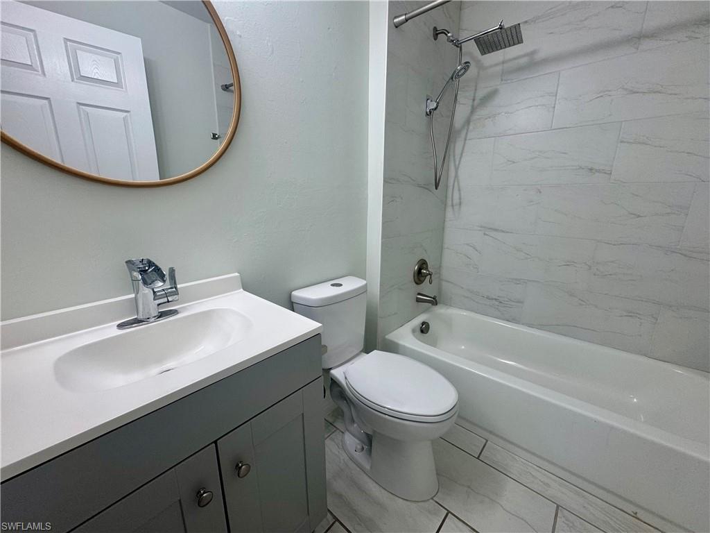 7066 Babcock Road Fort Myers, FL 33967 - Photo 13 of 15 a bathroom with a sink toilet and shower