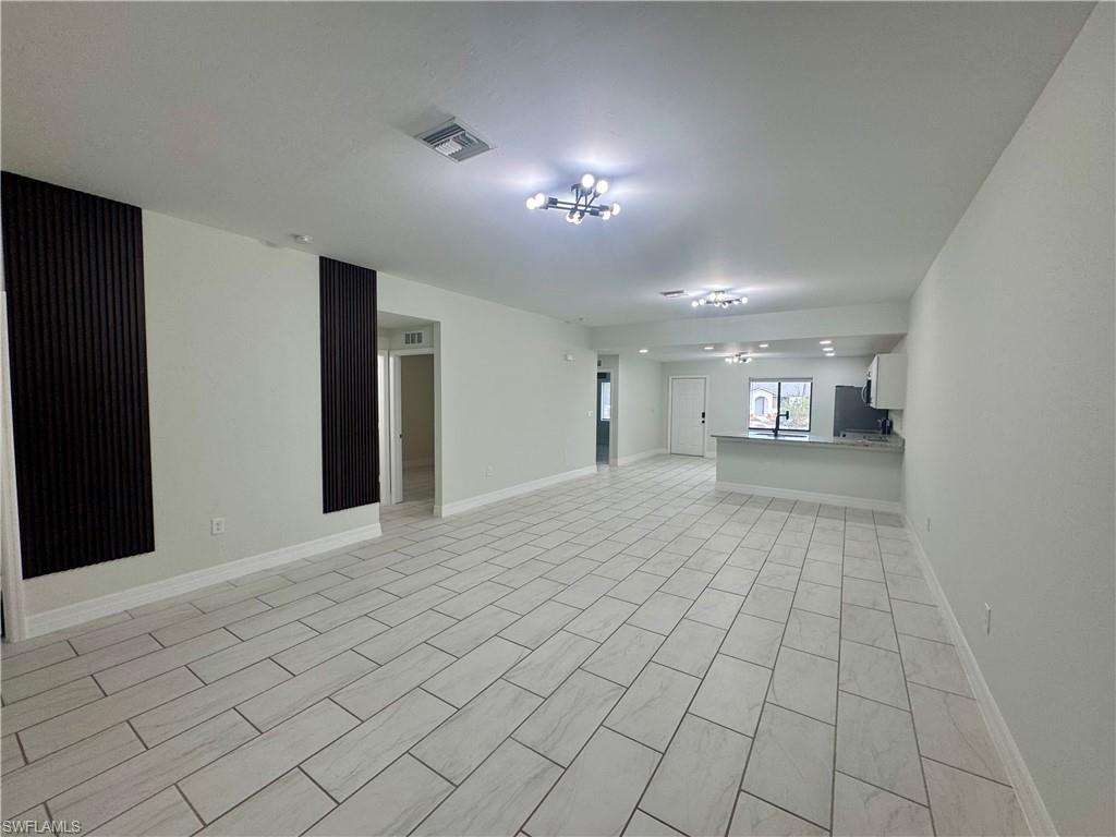 7066 Babcock Road Fort Myers, FL 33967 - Photo 2 of 15 a view of empty room with wooden floor