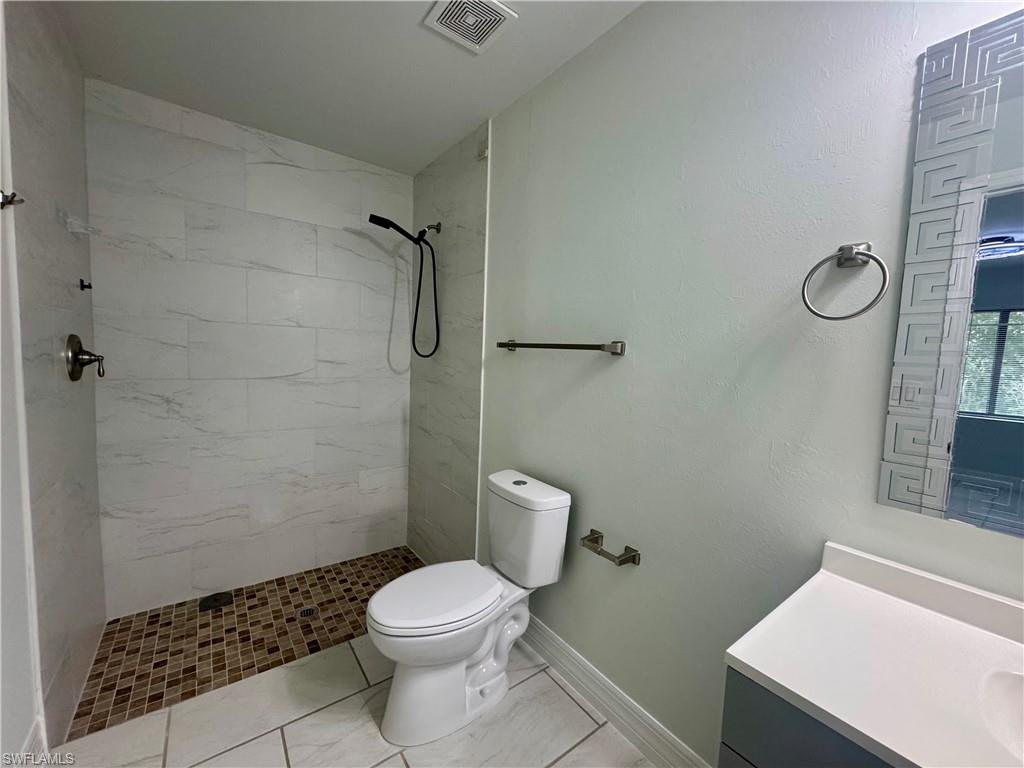 7066 Babcock Road Fort Myers, FL 33967 - Photo 10 of 15 a bathroom with a toilet and a shower