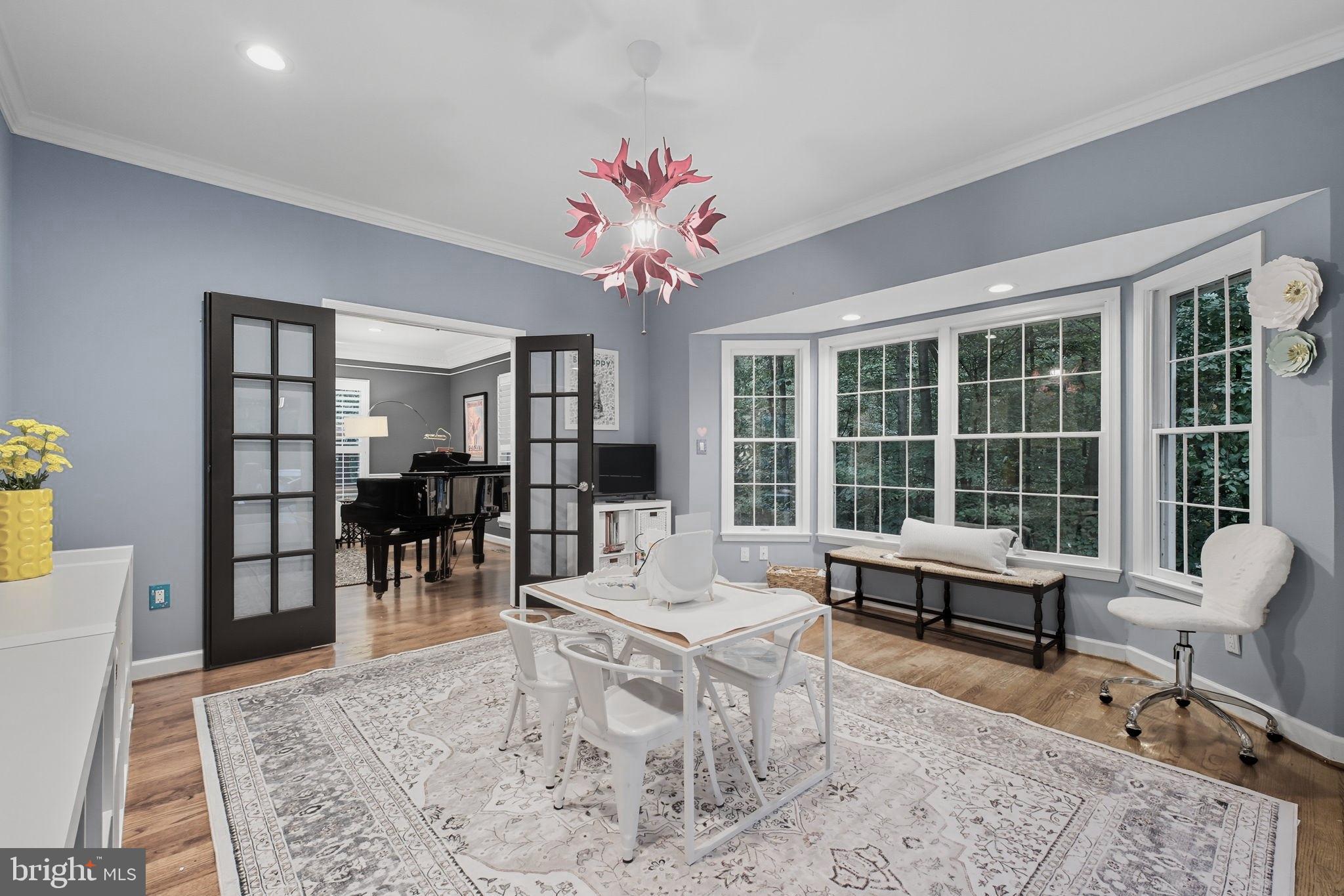 9217 Jeffery Road Great Falls, VA 22066 - Photo 12 of 80 a living room with furniture and a large window