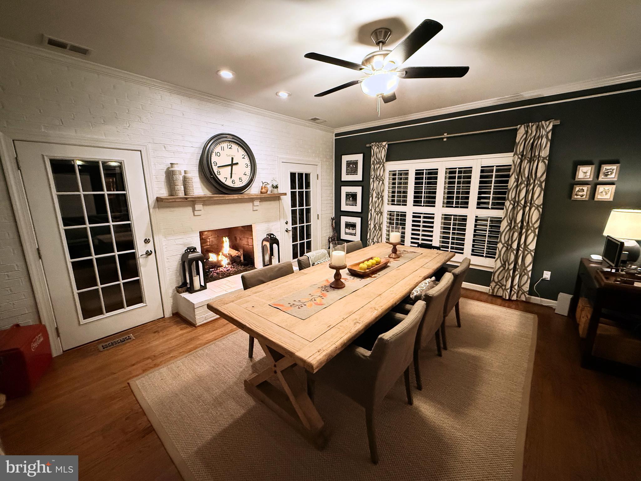 9217 Jeffery Road Great Falls, VA 22066 - Photo 25 of 80 a view of a dining room with furniture window and wooden floor