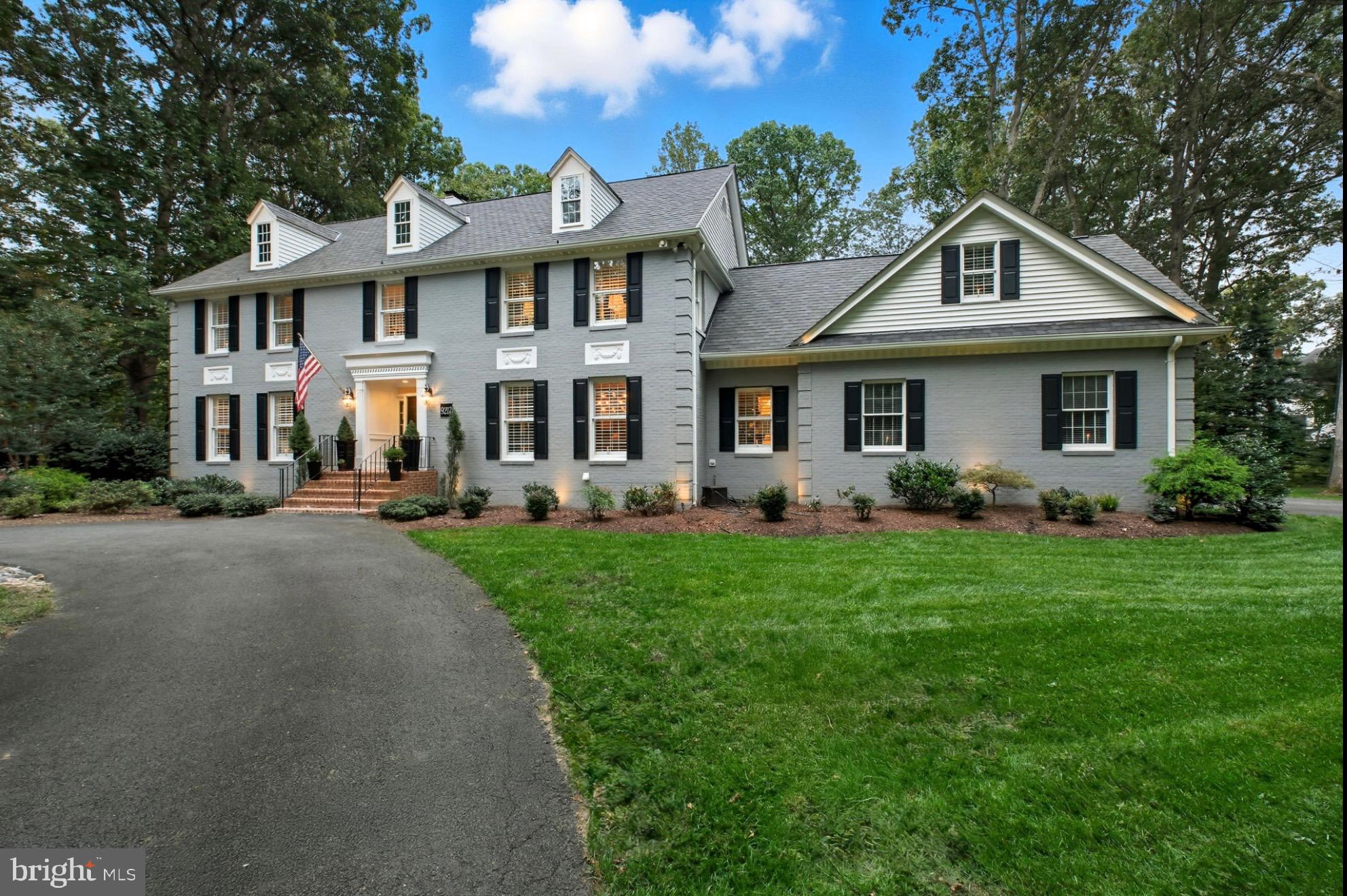 9217 Jeffery Road Great Falls, VA 22066 - Photo 3 of 80 a front view of a house with a yard