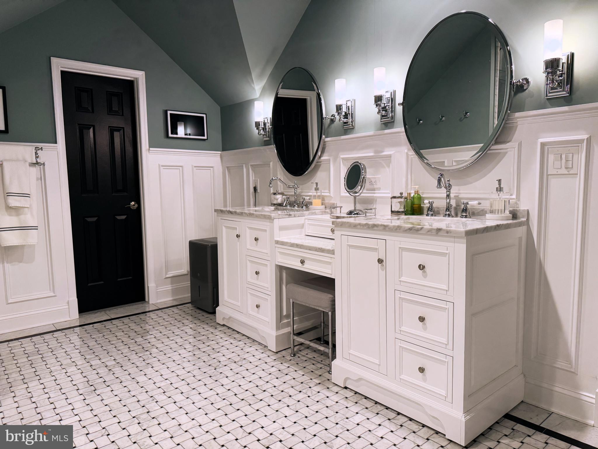 9217 Jeffery Road Great Falls, VA 22066 - Photo 41 of 80 a bathroom with a double vanity sink and a mirror