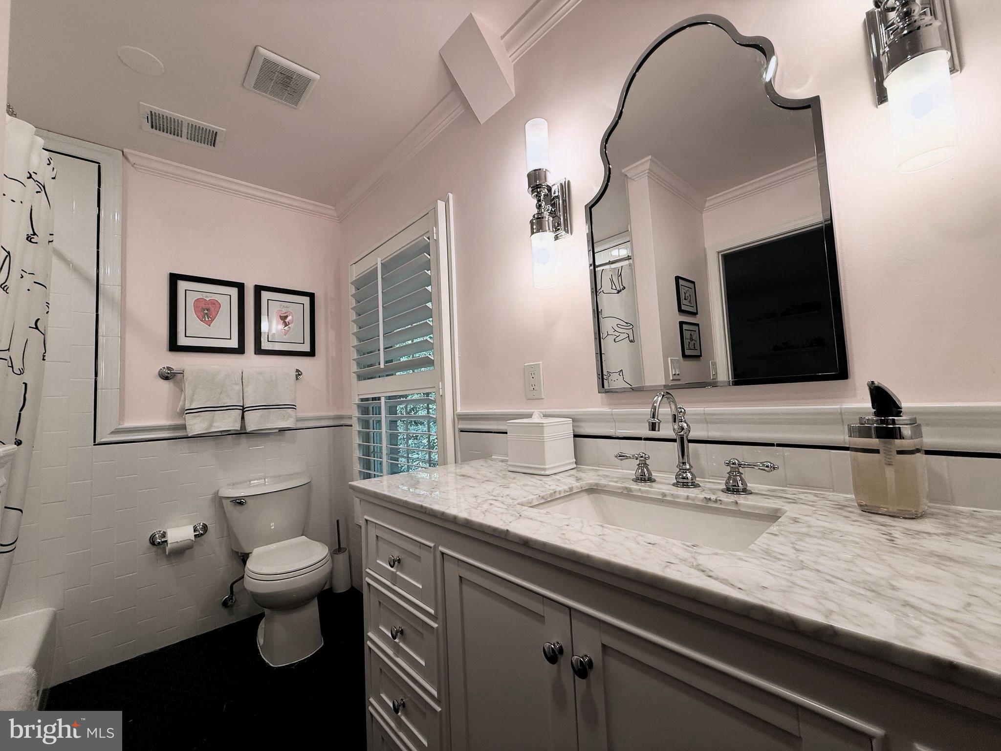 9217 Jeffery Road Great Falls, VA 22066 - Photo 51 of 80 a bathroom with a granite countertop toilet sink and mirror