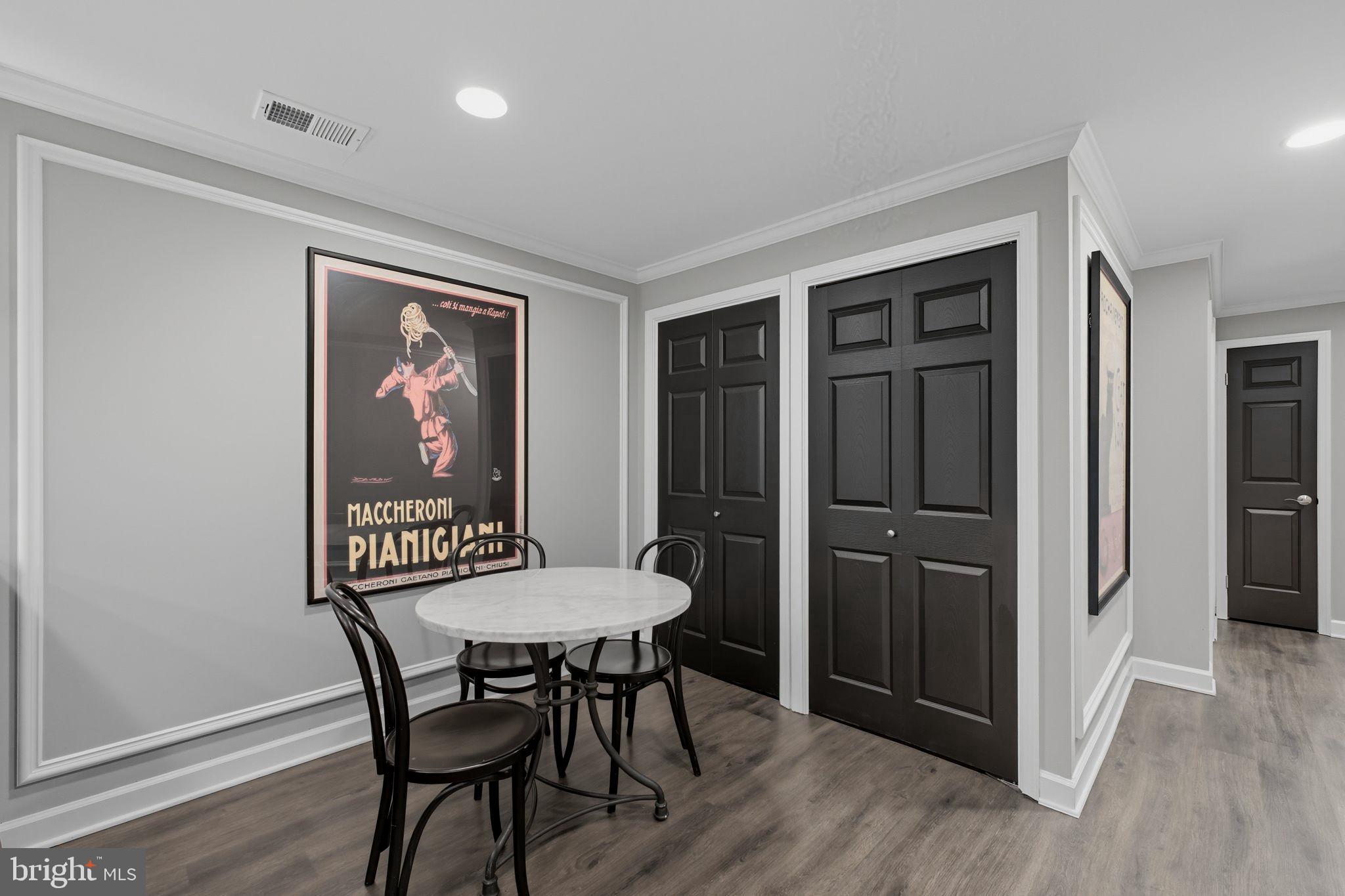 9217 Jeffery Road Great Falls, VA 22066 - Photo 60 of 80 a view of a dining room with furniture and wooden floor