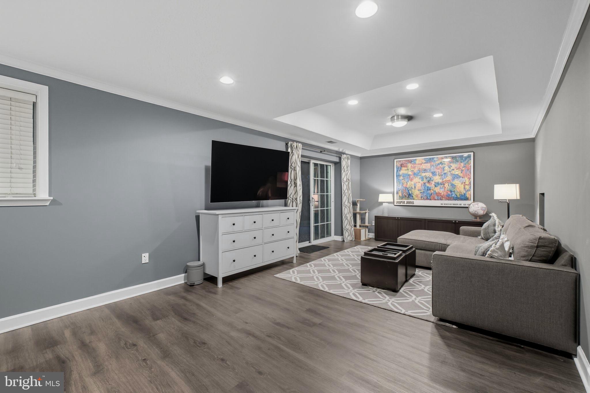 9217 Jeffery Road Great Falls, VA 22066 - Photo 63 of 80 a living room with furniture and a flat screen tv