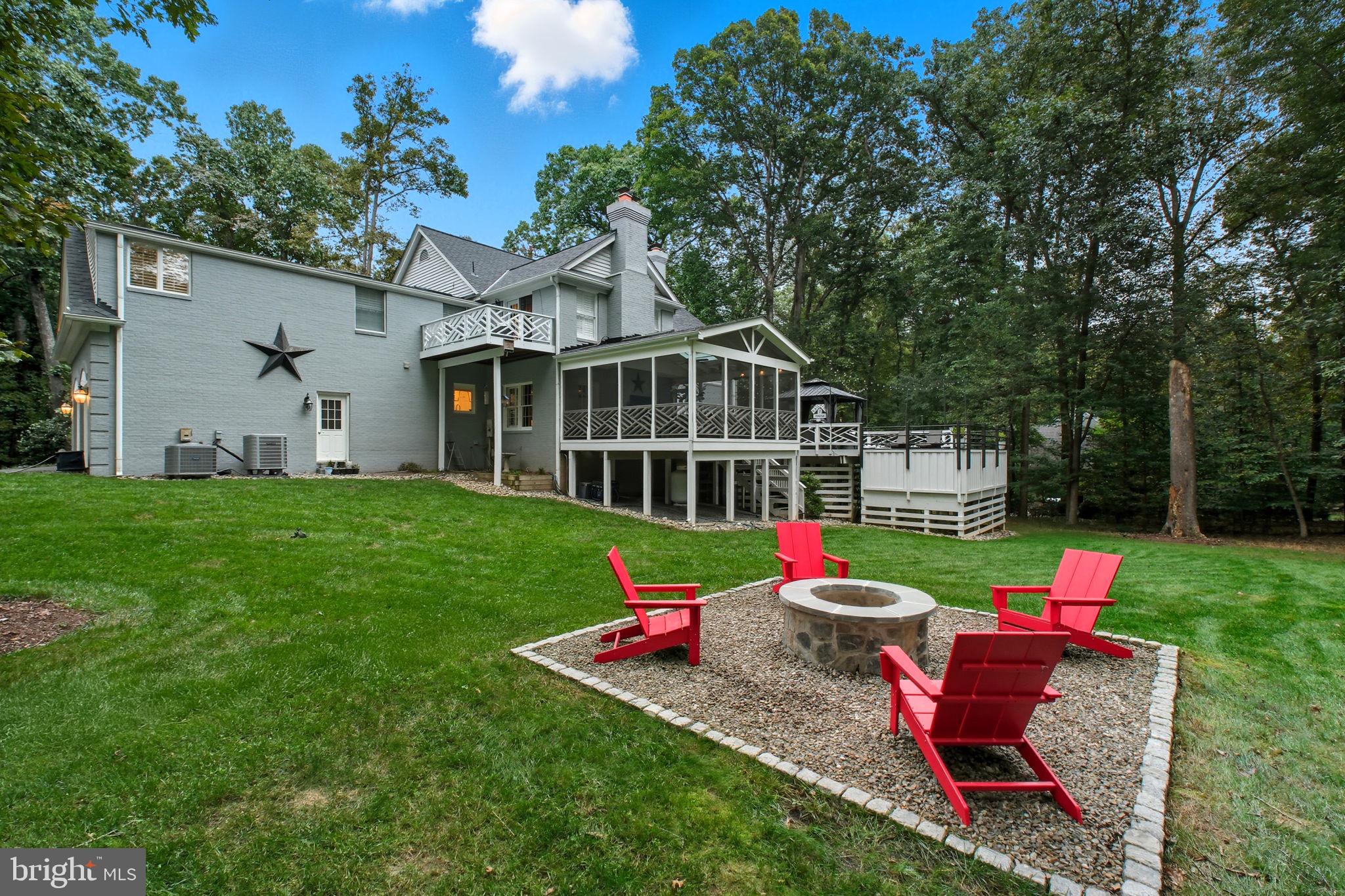 9217 Jeffery Road Great Falls, VA 22066 - Photo 75 of 80 a front view of a house with swimming pool and garden