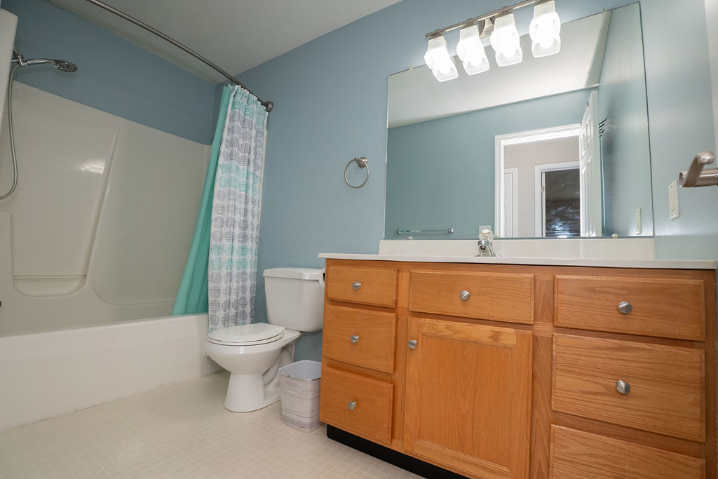 1708 Royal Pointe Drive Bloomington, IL 61704 - Photo 11 of 48 a bathroom with a toilet sink and mirror
