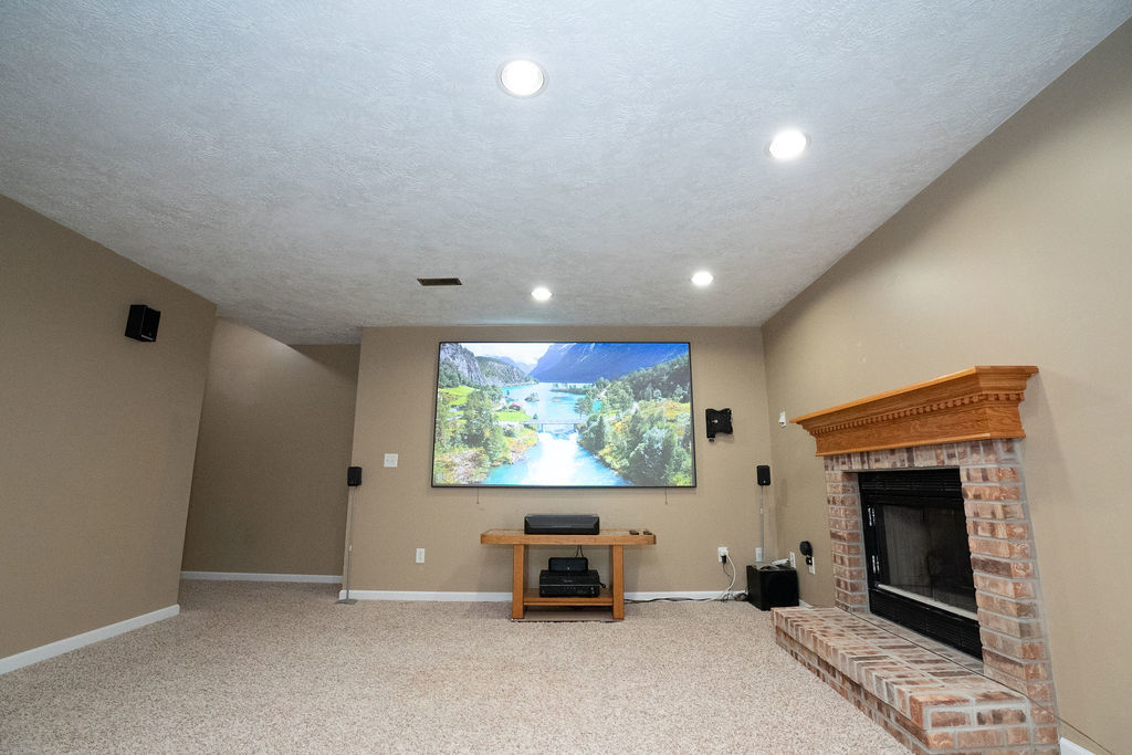 1708 Royal Pointe Drive Bloomington, IL 61704 - Photo 35 of 48 a living room with furniture and a fireplace