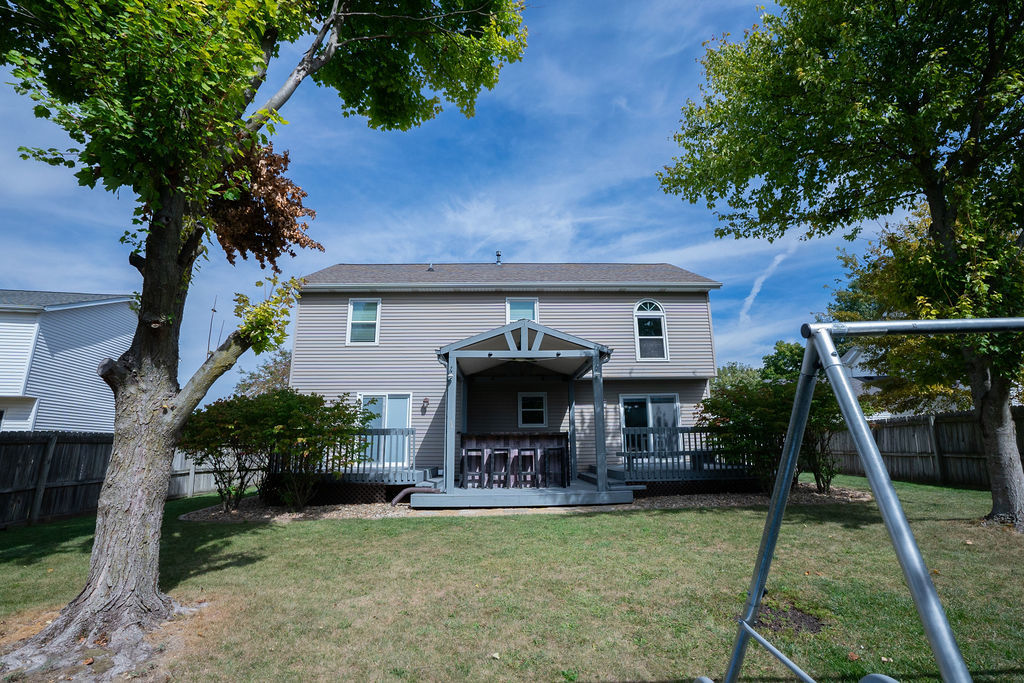 1708 Royal Pointe Drive Bloomington, IL 61704 - Photo 40 of 48 a view of a house with backyard porch and sitting area