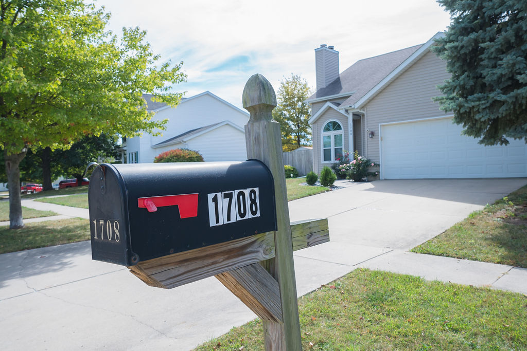 1708 Royal Pointe Drive Bloomington, IL 61704 - Photo 4 of 48 a view of a bench in front of a building