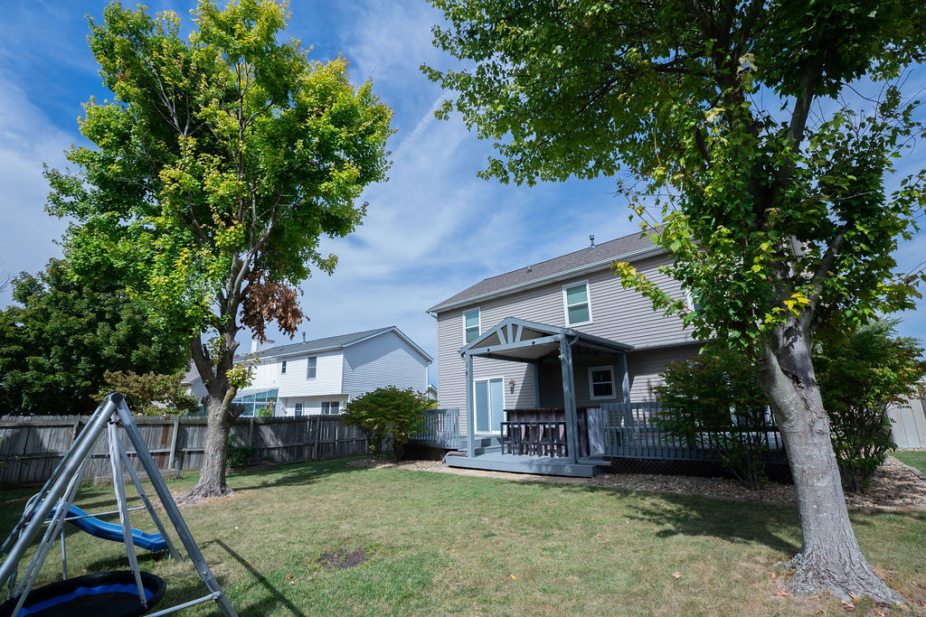 1708 Royal Pointe Drive Bloomington, IL 61704 - Photo 41 of 48 a view of a house with backyard porch and sitting area