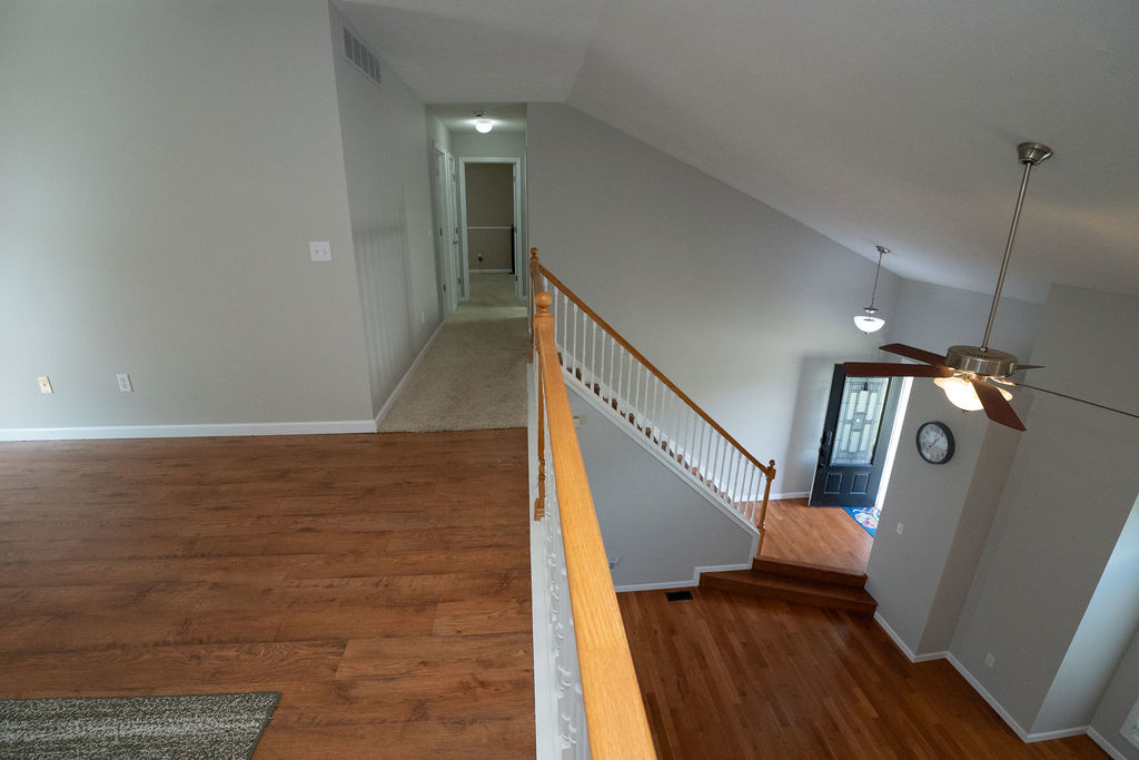 1708 Royal Pointe Drive Bloomington, IL 61704 - Photo 6 of 48 a view of entryway and hall with wooden floor